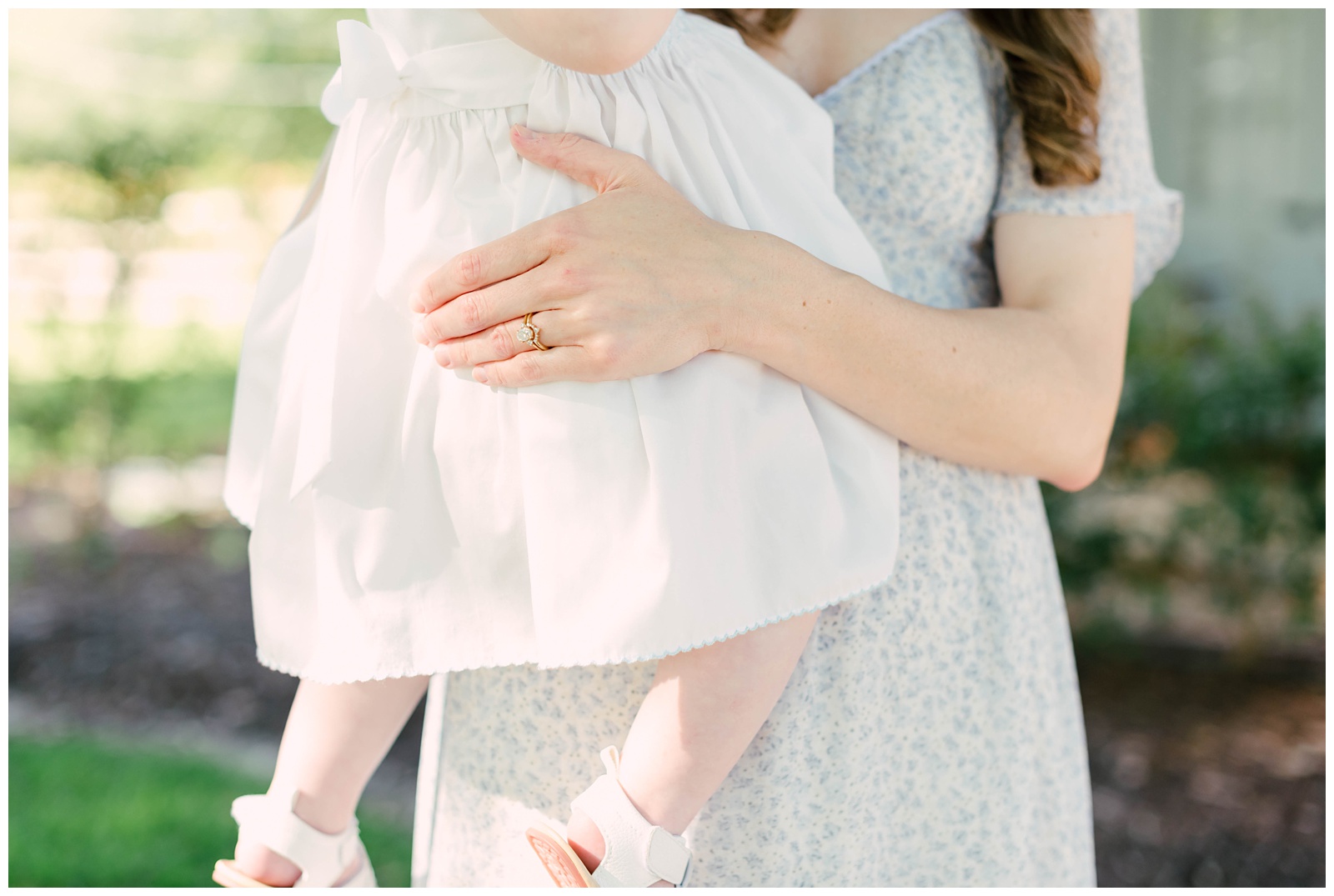 Baton Rouge Newborn Photographer - mom holds baby girls, close up of her hand