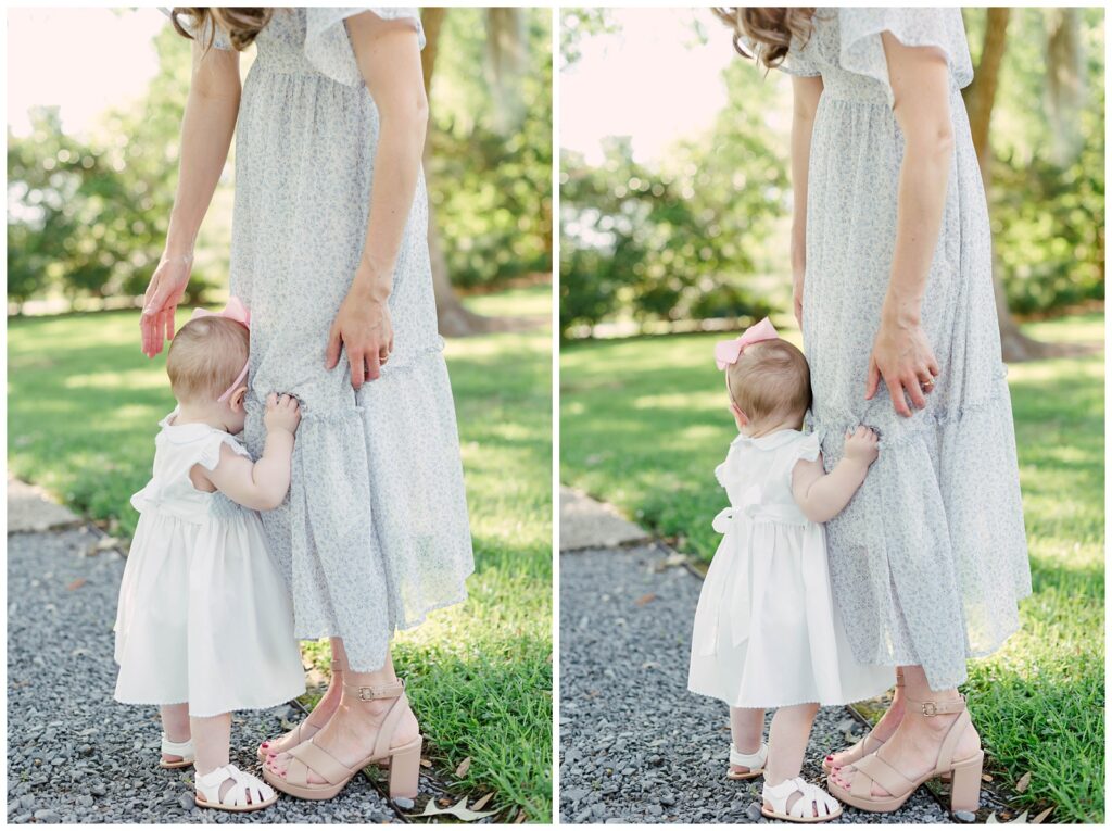 Baton Rouge Newborn Photographer - baby girl holds onto moms dress