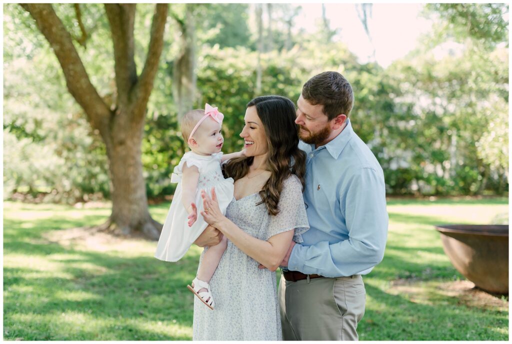 Baton Rouge Newborn Photographer- mom and dad clap hands with little girls